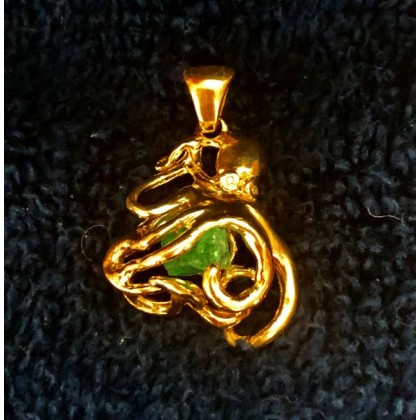 Atocha 1.15 carat Emerald mounted in a 14K three dimensional Octopus Bezel. 63242